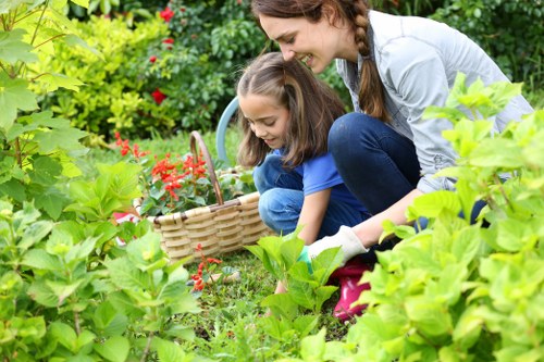 Gardener pruning plants during spring maintenance